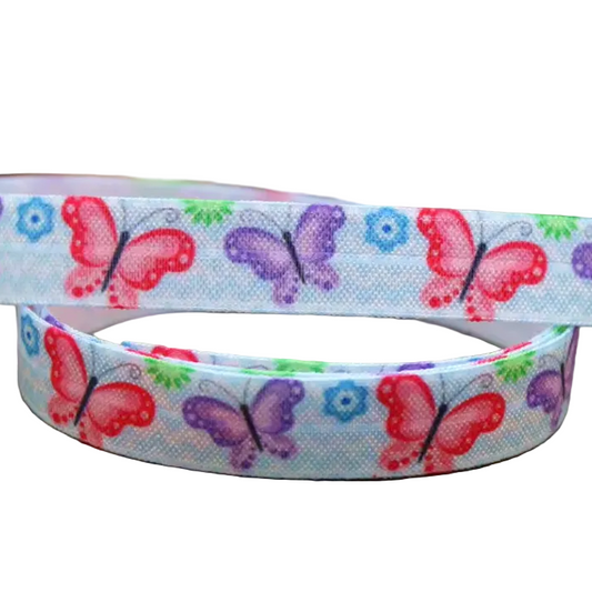 Ponto Baha softband hearing aid headband cochlear implant with colourful butterflies in red, purple, and green, and small blue flowers.