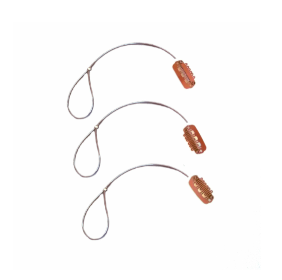 Three BAHA Ponto osia sentio adhear retaining lines with brown wig clip on a white background