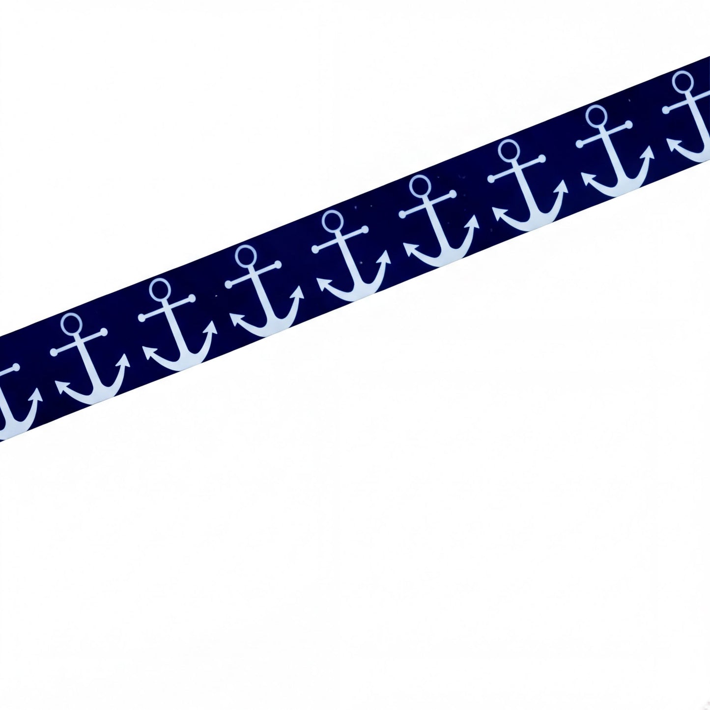 A strip of elastic for cochlear implant featuring a repeating white anchor pattern on a dark navy blue background, shown diagonally on a plain white background.