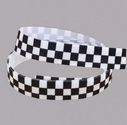 A black and white checkered pattern on an elastic for cochlear implant hearing aid headband