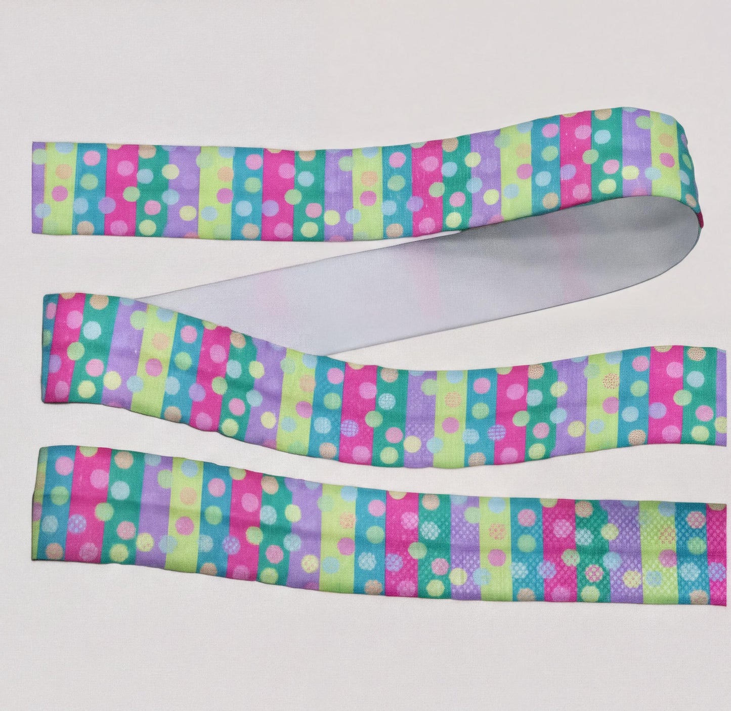 a colorful, multicoloured elastic for cochlear implant with a polka dot pattern.