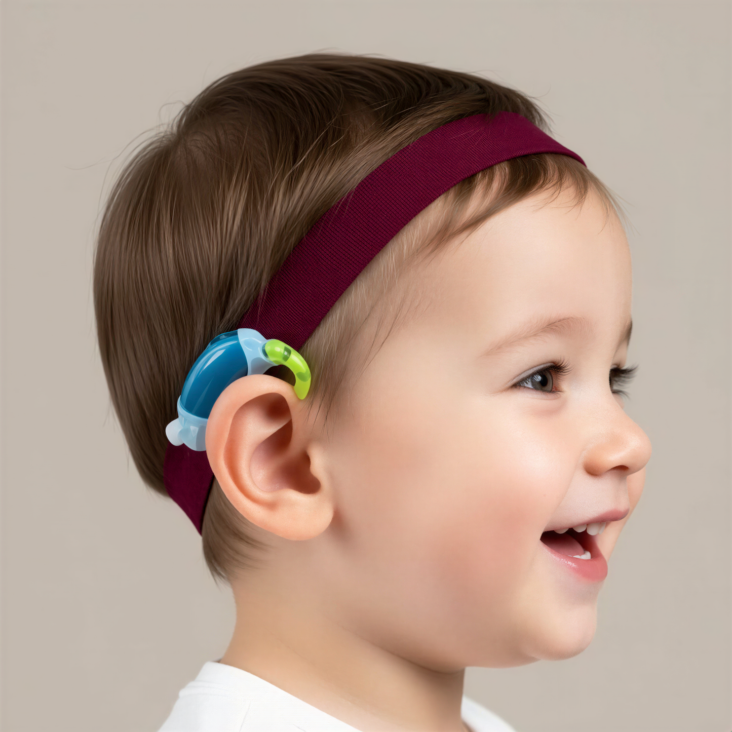 young child wearing a maroon hearing aid headband, with other colour options below