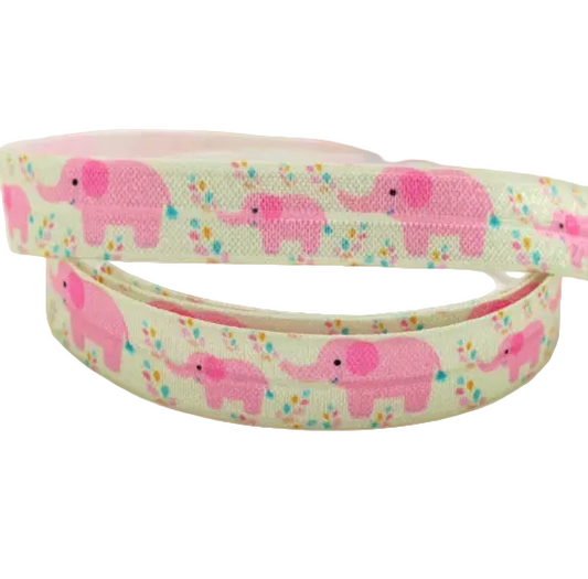 Ponto Baha softband hearing aid headband cochlear implant featuring a repeating pattern of pink cartoon elephants and small multicoloured flowers.