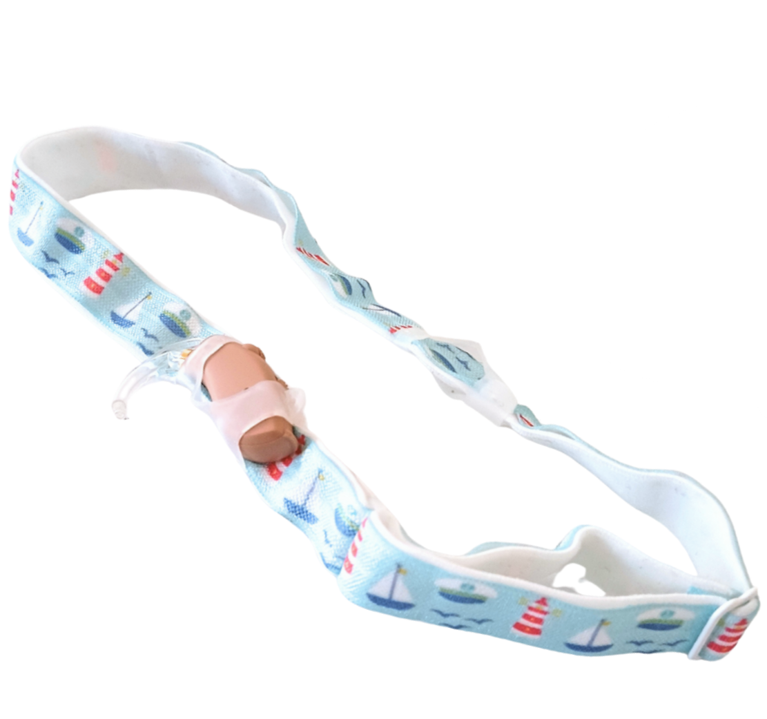 hearing aid headband with sailboat pattern on a white background