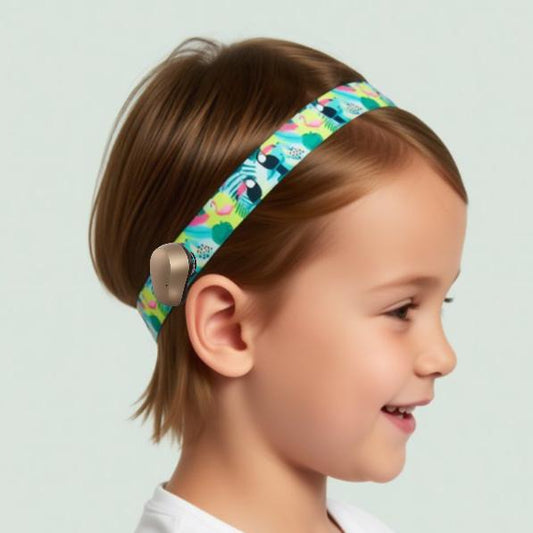 a colorful Ponto BAHA Softband hearing aid cochlear implant headband with a repeating pattern of tropical birds, including toucans, flamingos, and parrots, against a white background.
