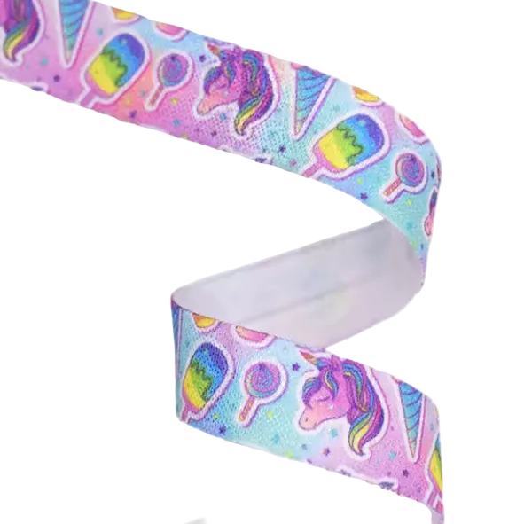 Ponto Baha softband hearing aid headband cochlear implant with featuring a colorful pastel pattern of unicorns, lollipops, and rainbows.