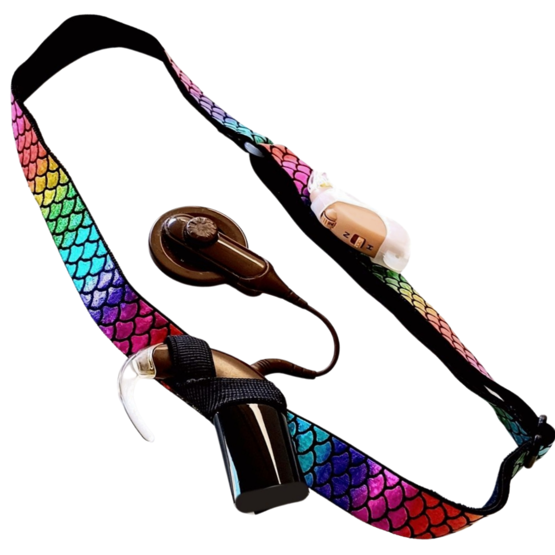 Colourful mermaid scale headband with a cochlear implant and hearing aid