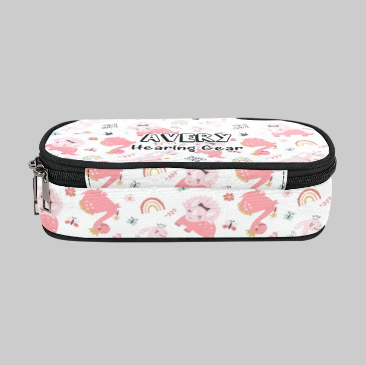 A rectangular zippered storage case for cochlear implant hearing aids with a white background and a pink cartoon animal print, featuring the text 'AVERY Hearing Gear' on the front,.