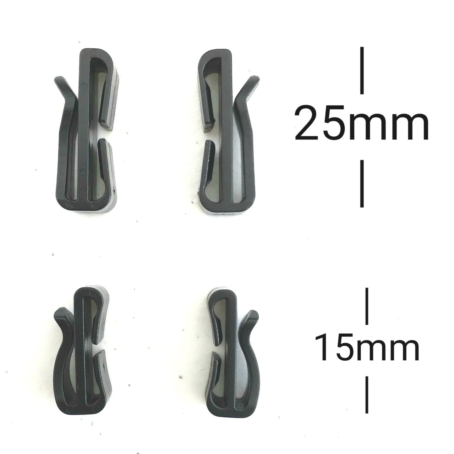 Four black plastic clips with measurements on a white background