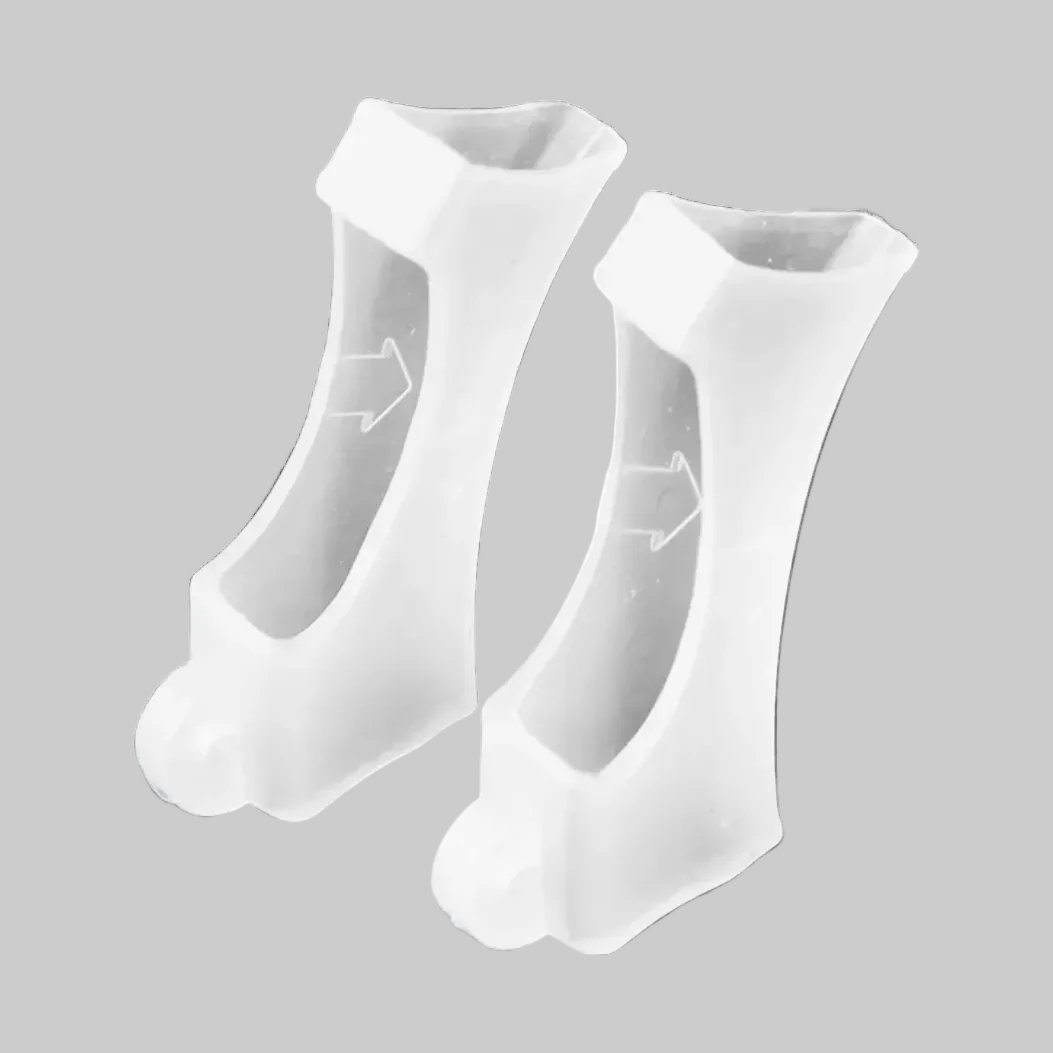 A pair of transparent silicone sleeves for hearing aids shown on a plain white background.