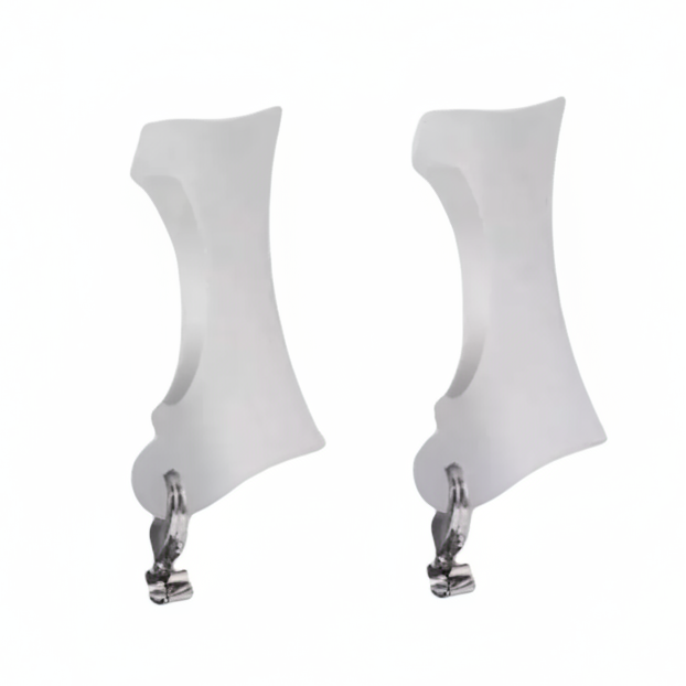 Two white curved plastic replacement grips for hearing aids, with silver metal mounting clips, shown side-by-side on a plain white background.