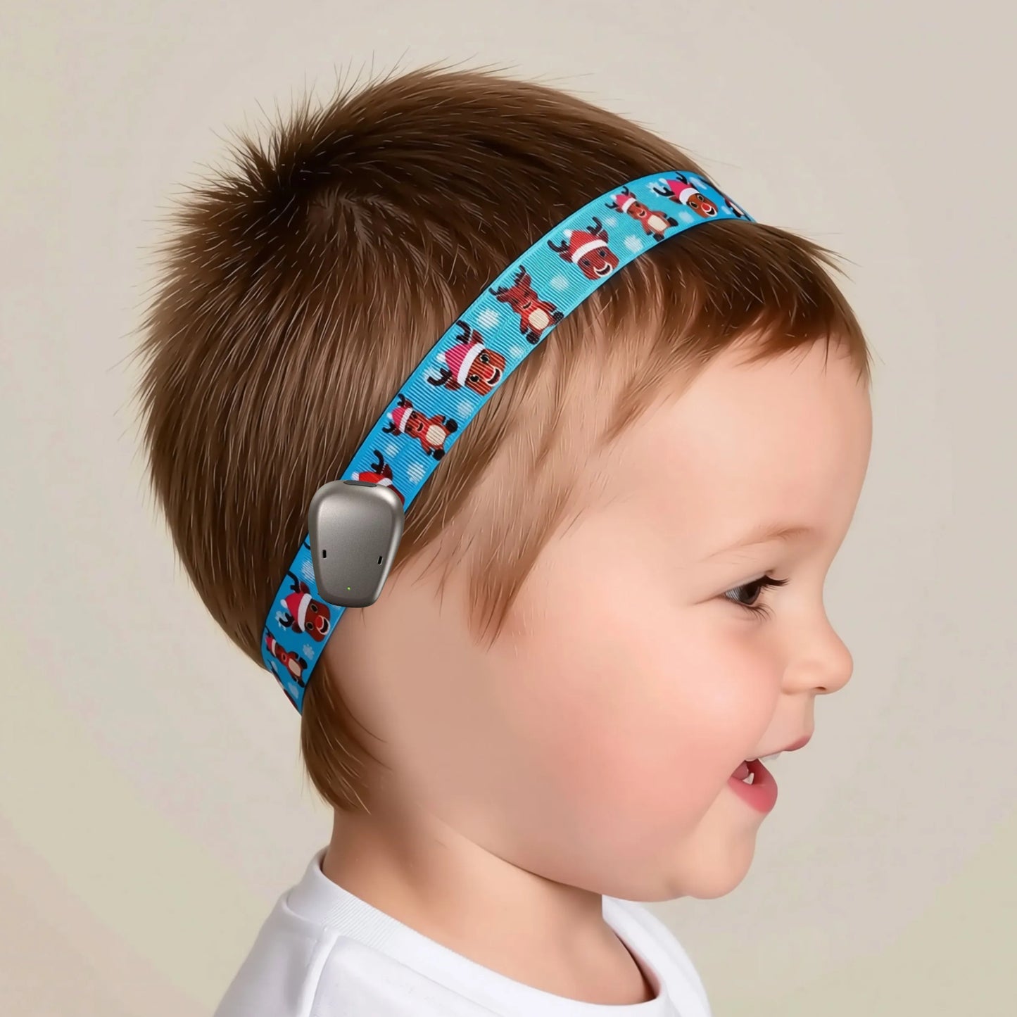 A blue ponto baha cochlear implant hearing aid headband with a repeating pattern of cartoon christmas reindeer, printed on it.
